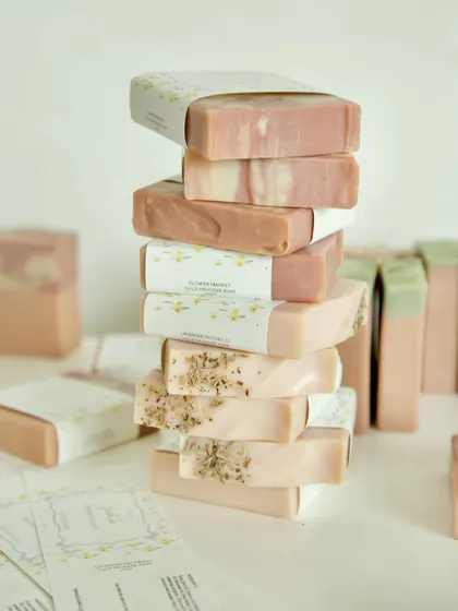 A tall stack of the assorted soaps, showcasing the different textures and colors chosen for the baby shower favors.