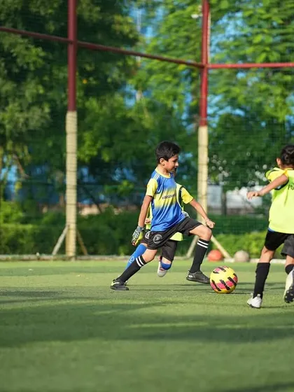 Football for life. A young player in goal during a practice match.