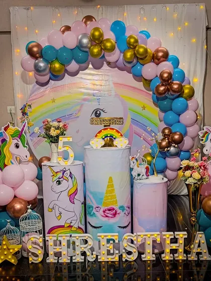 A magical unicorn-themed birthday party setup. With a rainbow pastel balloon arch, unicorn cutouts, and sparkling details, we bring fantasy worlds to life for your child's special day.