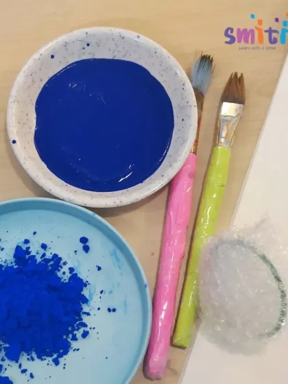 The simple materials for our hydrangea art project: paint, brushes, and bubble wrap. We believe creativity can be sparked with everyday items.