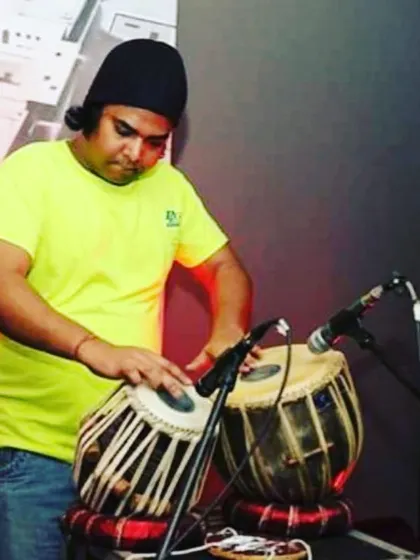 A candid shot from a live fusion gig. The casual attire and stage setup reflect the modern, experimental nature of these performances where I mix tabla with different genres.