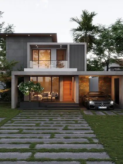 A compact contemporary home in Chavakad with a simple, two-level design. The integrated carport and glass-railed balcony make for a highly functional and modern layout.