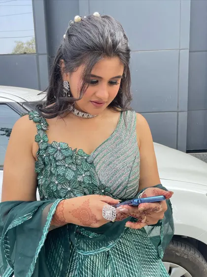 A candid moment. The makeup looks flawless even when she's not posing for the camera.