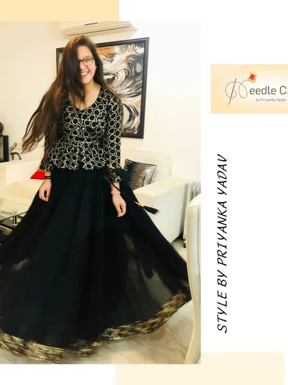A client's joy is everything. This beautiful black lehenga, with its shimmering gold border, was made from an old saree. The twirl-worthy skirt and patterned top came together to create an outfit she absolutely loved.