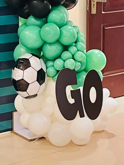 A close-up of the "GOAL" cutout and football balloon detail, showing the creative elements we add to our themes.
