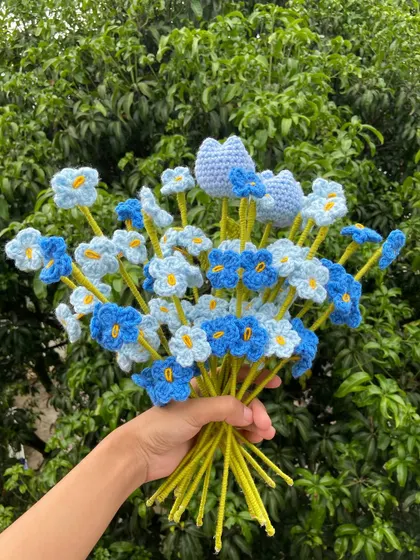 A beautiful blue-themed bouquet with forget-me-nots and heart-shaped flowers.