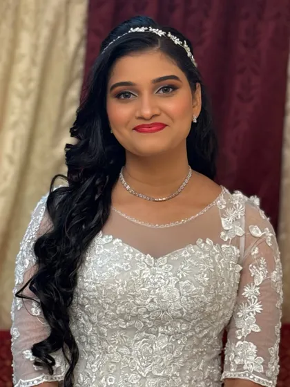 A smiling portrait of our Christian bride. Her joy is infectious, and her makeup is designed to be timeless and photograph beautifully.