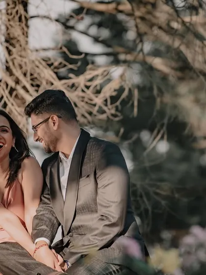 A moment of pure, unscripted laughter between a couple during their outdoor shoot. This is what I mean by capturing real moments, not just poses, against a beautiful natural backdrop.