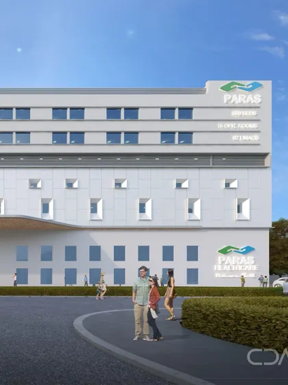 The new block at Paras Hospital, Panchkula, connects to the existing facility through a landscaped plaza and an elevated bridge. This design boosts capacity and enhances care delivery while integrating with existing operations.