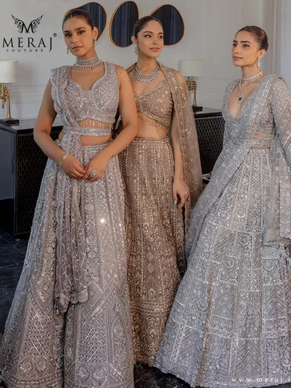 Three models showcase the versatility of silver and gold, each wearing a unique lehenga from the 'Ruvaah' collection, perfect for a coordinated bridal party.