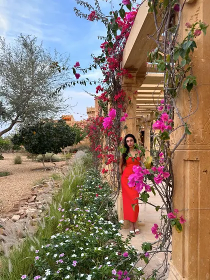 Strolling through the beautiful bougainvillea-laden corridors of Suryagarh, Jaisalmer. These locations provide stunning backdrops for wedding events.