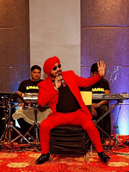 We also cover event performances. Here's a shot of a singer entertaining guests at a wedding sangeet.