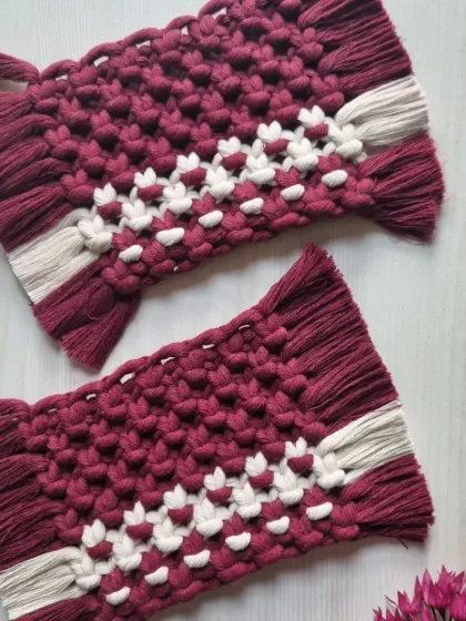 A beautiful pair of maroon and white rectangular coasters. The pattern adds a lovely detail to the rich color.