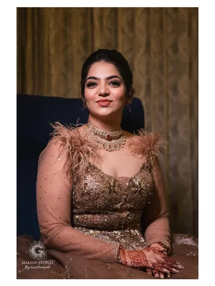 A portrait of Reshma ready for her cocktail event. The makeup is sophisticated and glamorous, a perfect choice for an elegant evening celebration.