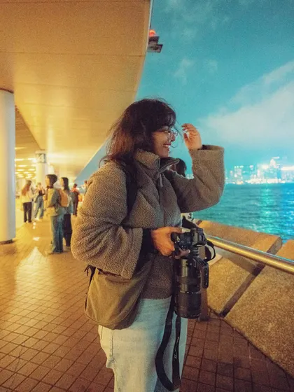 People joke that I don't need a gym membership because I carry around nearly 5kg of camera gear when I travel! This was me in Hong Kong, fully loaded with my equipment, ready for a night of shooting.