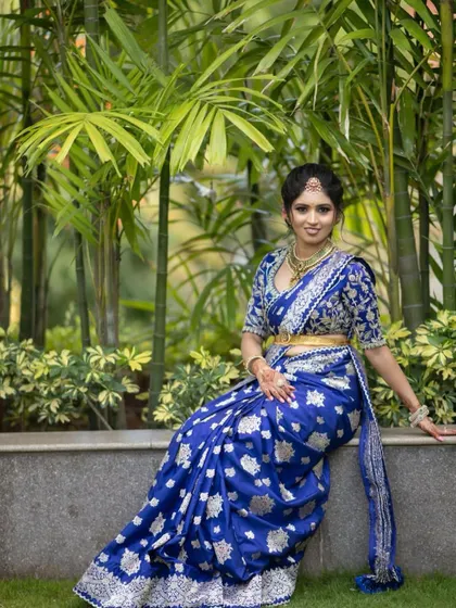 A duplicate of image 107, showcasing the full royal blue Banarasi saree and custom blouse.