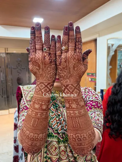 A heavy, traditional back of hand design for the mother of the groom. The rich, dense patterns show her importance and celebrate her joy on this special day.