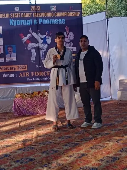 My student with his gold medal at the Delhi State Cadet Championship event.