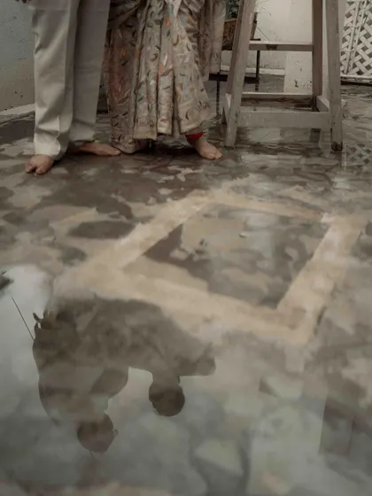 An artistic shot of their reflection in the water on the terrace floor. I saw this as a metaphor for their love, reflecting their journey together in a unique and beautiful way.