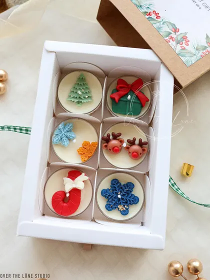 The six-piece 'Merry Christmas' tealight set, all packed up in its beautiful gift box.