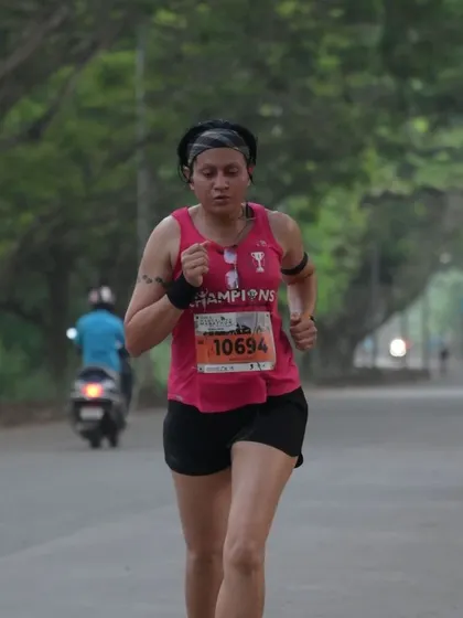 A candid shot during the Mangalore Marathon. This shows the focus and determination required mid-race to maintain pace.