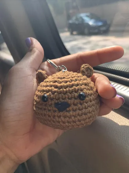 A simple and sweet bear face keychain, perfect for adding a touch of cuteness to your belongings.