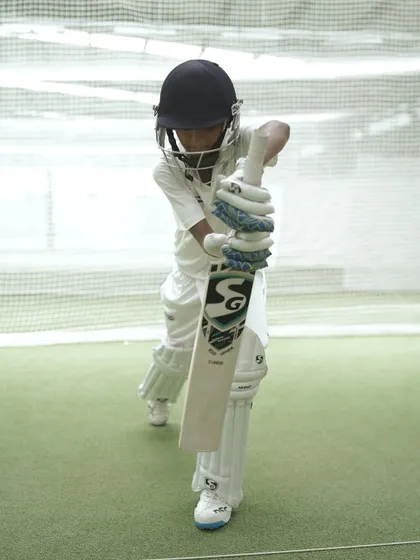 A young player demonstrates a perfect defensive block. We are excited to groom young talent and build their skills from the ground up.
