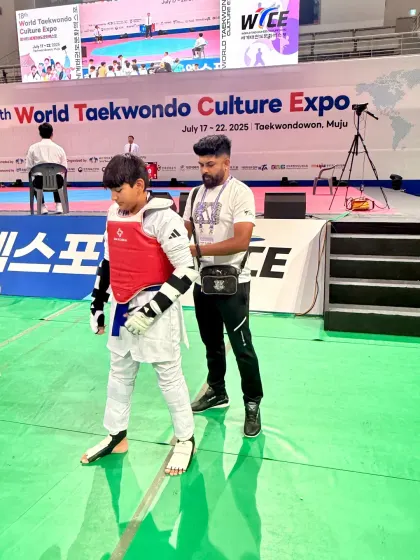 Walking with my student towards the competition mat.