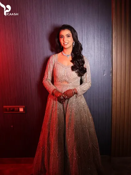 A wide shot showing the client's full reception attire, looking absolutely regal.