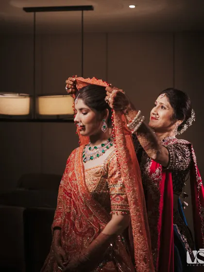 Before the world sees her as a bride, there are these quiet moments. A mother’s hands adjusting the veil one last time, a gesture filled with a lifetime of love. We believe the real story is in these unposed, in-between moments that are heavy with emotion.