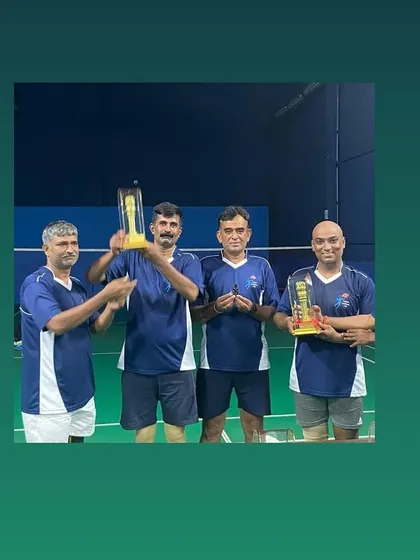 A stylized shot of the winning team members with their trophies.
