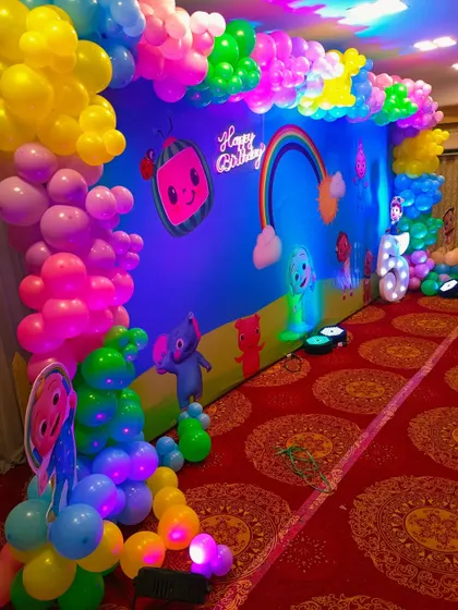 Another angle of the Cocomelon stage, showing the character cutouts.