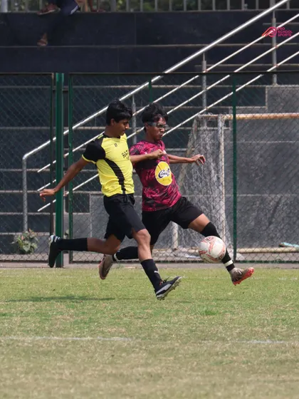 A fierce 1v1 battle for the ball, highlighting the competitive spirit we instill in our players.