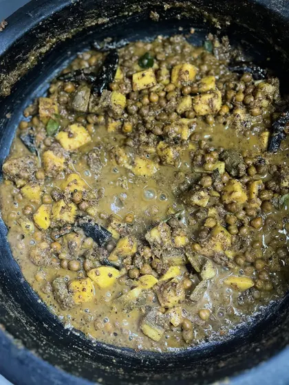 Another look at the Kootu Curry in a traditional manchatti (earthen pot). Cooking in these pots adds a unique, earthy flavor to the dish.