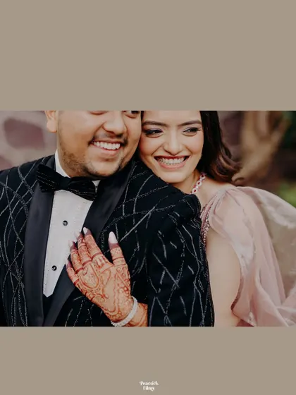 A close-up of the couple's beaming smiles. This candid shot captures the pure happiness and love they share.