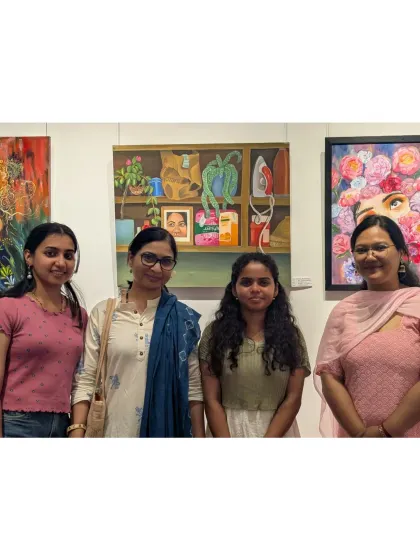 Posing with friends and fellow artists at the exhibition. The support of my peers is a constant source of motivation.