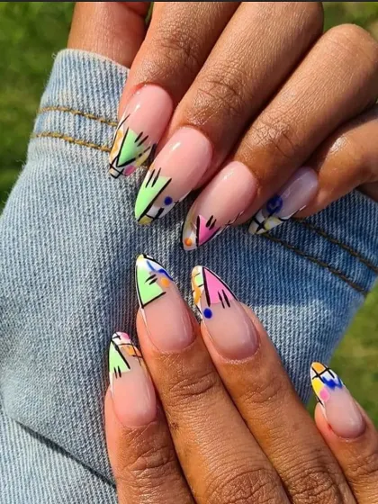 A client's photo of her amazing abstract art nails. This design features a mix of geometric shapes and colors on a neutral base for a modern, artistic look.