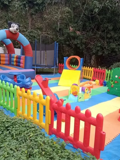 Here is a complete outdoor activity center featuring a bouncy castle, a trampoline for extra jumping fun, and a play structure with a slide. I ensure every piece of equipment is sturdy and from top international brands for safe, reliable play.