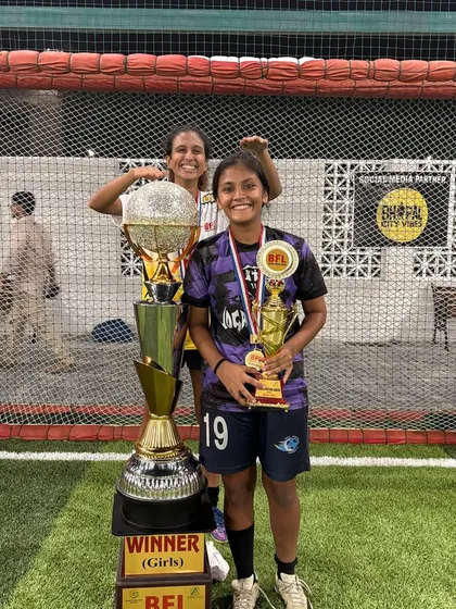 Our Best Forward, Nishka, posing with the BFL winner's trophy and her individual award.