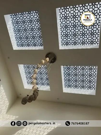 For this project, we installed a series of four square skylights, each with an intricate geometric pattern. This design distributes light evenly across a large room and adds a decorative element to the ceiling, complementing the modern chandelier.