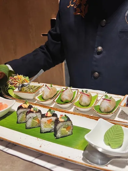 Showcasing our global culinary range, this platter features delicate dim sum and expertly rolled sushi. It's a popular choice for couples wanting to offer their guests a taste of international cuisine alongside traditional Indian dishes.