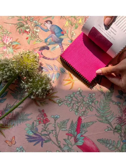 The 'Parco Dora' fabric is a tropical dream, teeming with floral blooms, toucans, and monkeys. This mood board shows how I pair such a vibrant print with a solid colour to create a balanced, lively design.