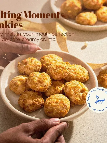 My Melting Moments Cookies, buttery and delicate with a creamy crumb, arranged on a plate. They are a perfect addition to a festive hamper.