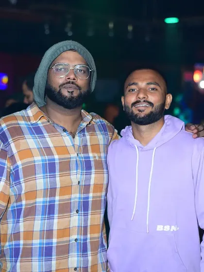 Posing with a friend at the club. Building a community around music is one of the best parts of being a DJ.