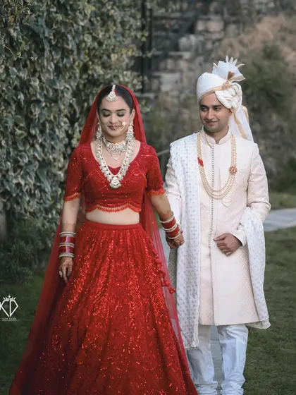 The couple walking hand-in-hand after their ceremony, a classic shot symbolizing the start of their new journey.