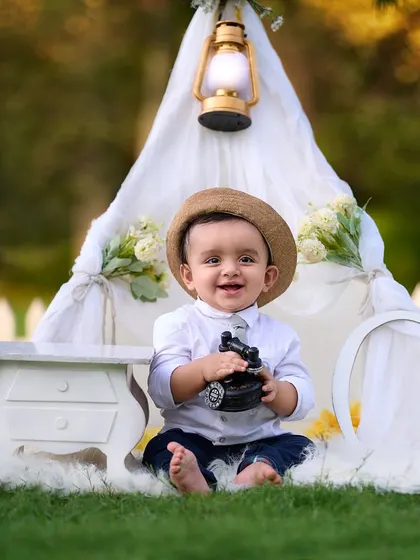 A happy smile from our little boss baby. My goal is to make your baby comfortable and happy, allowing me to capture their true personality during their first birthday photoshoot.