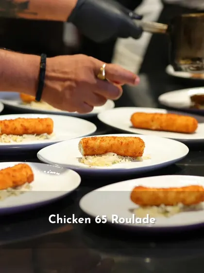 Another look at the Chicken 65 Roulade being plated for the Spotify Supper. Each plate is carefully assembled to ensure consistency and visual appeal for a large number of guests.