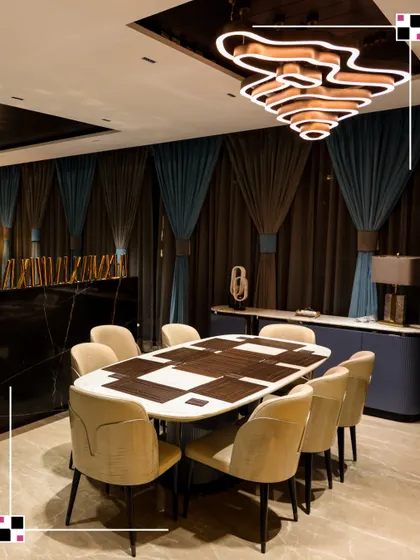 The dining area is where memories are made. I designed this space not just for meals, but for connection, with a unique dining table and dramatic lighting that encourages conversation and shared moments.