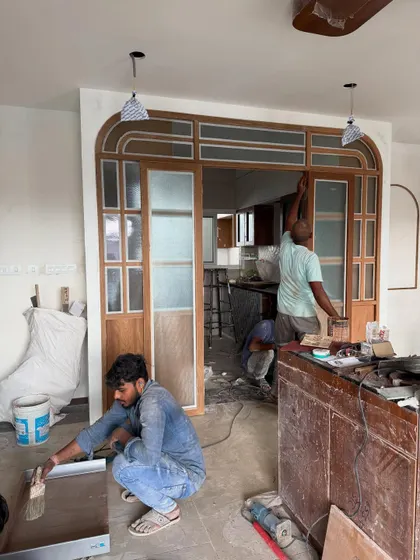 Here’s a look at the magic in progress. Our carpenters are installing a custom-designed arched door frame, a key element that will transform this entryway. It’s this level of on-site craftsmanship that turns a blueprint into a beautiful reality.