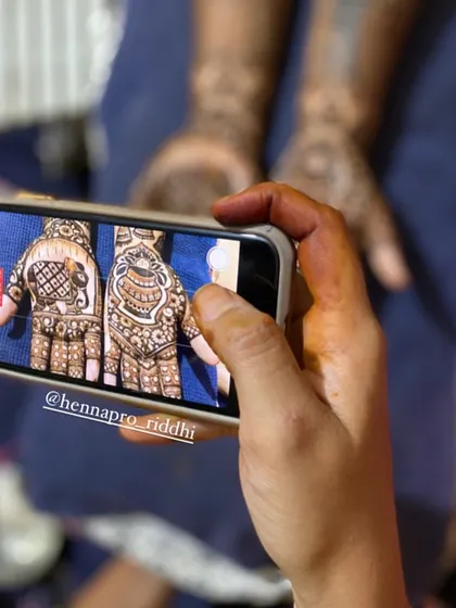 A behind-the-scenes shot of me capturing the perfect photo of a semi-bridal design. The final look features beautiful peacocks and detailed patterns, perfect for any wedding guest.